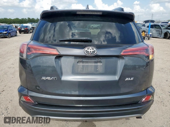 2018 Toyota RAV4 XLE with VIN 2T3WFREV2JW409292, listed as a Copart auction lot 61577355 with 189,258 mi miles and Salvage title. Bid and sale history available at DreamBid. Image 6.