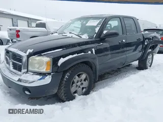 2005 Dodge Dakota SLT with VIN 1D7HW48N55S271727, listed as a IAAI auction lot 41249537 with 196,500 mi miles. Bid and sale history available at carsss.com. Image 2.