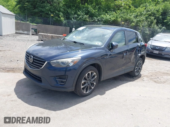 2016 Mazda CX-5 Grand Touring z VIN JM3KE4DY1G0817562, wystawiony jako IAAI lot #42289929 z przebiegiem 135 476 mil mil oraz . Historia ofert i sprzedaży dostępna na DreamBid. Obrazek 18.
