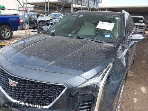 2019 Cadillac XT4 FWD Sport z VIN 1GYFZER49KF215843, wystawiony jako IAAI lot #41912861 z przebiegiem 102 922 mil mil oraz . Historia ofert i sprzedaży dostępna na DreamBid. Obrazek 6.