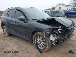 2016 Mazda CX-5 Sport with VIN JM3KE2BY6G0894886, listed as a IAAI auction lot 41609623 with 172,431 mi miles. Bid and sale history available at carsss.com. Image 1.