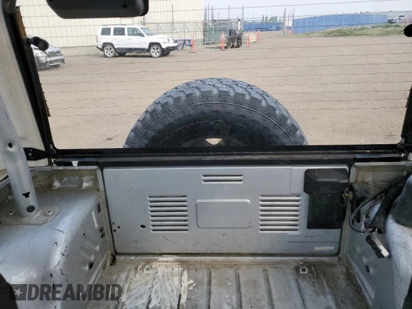 2003 Jeep Wrangler Sport z VIN 1J4FA49S93P306817, wystawiony jako Copart lot #60136385 z przebiegiem 217 208 mil mil oraz Czysty tytuł • Clean title. Historia ofert i sprzedaży dostępna na DreamBid. Obrazek 10.