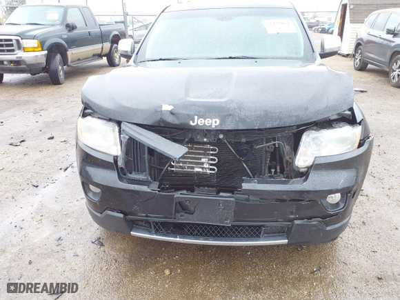 2013 Jeep Grand Cherokee Limited with VIN 1C4RJFBG4DC633137, listed as a IAAI auction lot 41235064 with 163,820 mi miles. Bid and sale history available at carsss.com. Image 6.