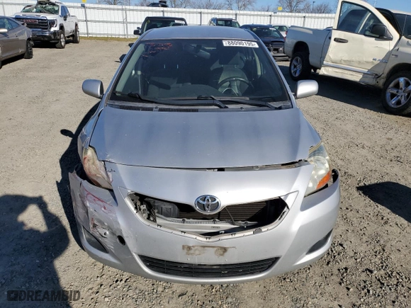 2011 Toyota Yaris with VIN JTDBT4K35B1409879, listed as a Copart auction lot 88090195 with 133,900 mi miles and Salvage Title. Bid and sale history available at carsss.com. Image 5.