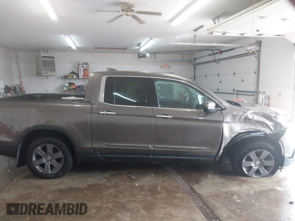 2020 Honda Ridgeline RTL-E with VIN 5FPYK3F75LB001516, listed as a IAAI auction lot 41605859 with 93,902 mi miles and . Bid and sale history available at DreamBid. Image 13.