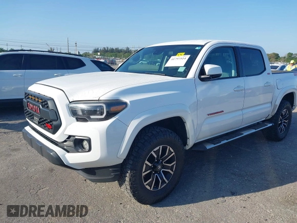 2018 Toyota Tacoma SR with VIN 5TFAX5GN2JX128621, listed as a IAAI auction lot 41797514 with 216,251 mi miles and . Bid and sale history available at DreamBid. Image 2.