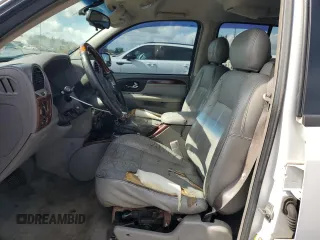 2005 GMC Envoy Denali z VIN 1GKES63MX52321416, wystawiony jako Copart lot #57587575 z przebiegiem 252 571 mil mil oraz Szkody całkowita. Historia ofert i sprzedaży dostępna na DreamBid. Obrazek 7.