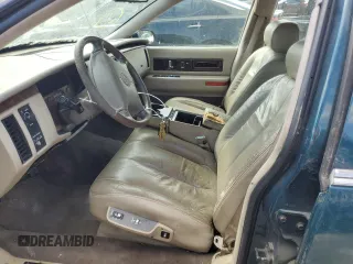 1995 Cadillac Fleetwood z VIN 1G6DW52P3SR704864, wystawiony jako Copart lot #46631025 z przebiegiem Nie podano mil oraz Tytuł czysty. Historia ofert i sprzedaży dostępna na DreamBid. Obrazek 7.