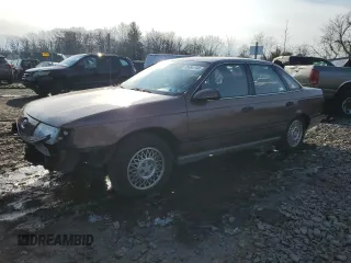 1989 Ford Taurus GL with VIN 1FABP52U1KA299938, listed as a Copart auction lot 86684144 with 52,675 mi miles and Salvage Title. Bid and sale history available at carsss.com. Image 1.