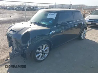 2012 MINI Hardtop S with VIN WMWSV3C5XCTY26065, listed as a IAAI auction lot 41811317 with 74,858 mi miles and . Bid and sale history available at DreamBid. Image 2.