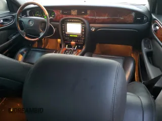 2004 Jaguar XJ with VIN SAJEA71C54SG01326, listed as a Copart auction lot 77449324 with 72,935 mi miles and Salvage Title. Bid and sale history available at carsss.com. Image 8.