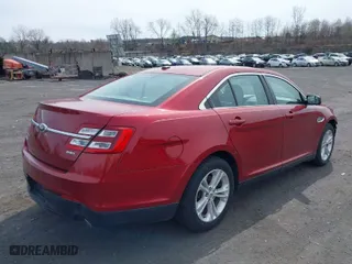 2014 Ford Taurus SEL with VIN 1FAHP2E85EG136900, listed as a IAAI auction lot 41941219 with 123,631 mi miles. Bid and sale history available at carsss.com. Image 4.