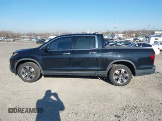 2019 Honda Ridgeline RTL-E with VIN 5FPYK3F7XKB033652, listed as a IAAI auction lot 41751421 with 96,774 mi miles and . Bid and sale history available at DreamBid. Image 13.