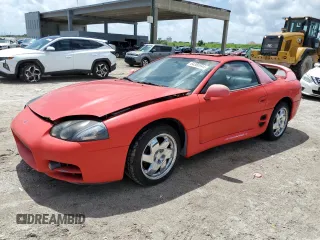 1999 Mitsubishi 3000GT GT z VIN JA3AM84J4XY001608, wystawiony jako Copart lot #64366944 z przebiegiem 153 804 mil mil oraz Tytuł czysty. Historia ofert i sprzedaży dostępna na DreamBid. Obrazek 1.