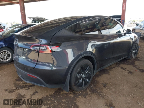 2024 Tesla Model Y with VIN 7SAYGDED9RF053203, listed as a IAAI auction lot 41906729 with Not Provided miles and . Bid and sale history available at DreamBid. Image 4.