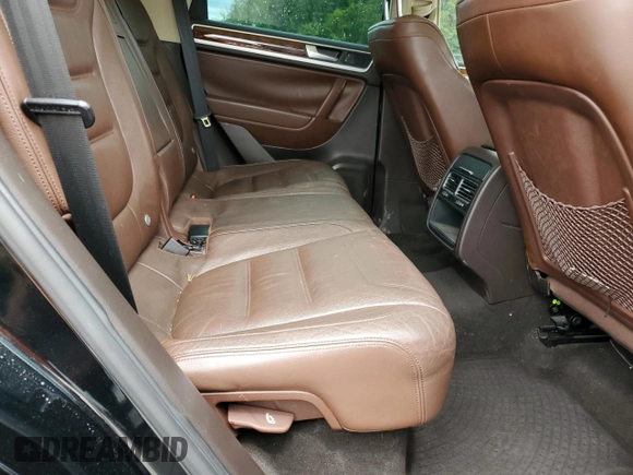 2012 Volkswagen Touareg Sport z VIN WVGEF9BP7CD009824, wystawiony jako Copart lot #58311915 z przebiegiem 154 397 mil mil oraz Szkoda całkowita • Salvage title. Historia ofert i sprzedaży dostępna na DreamBid. Obrazek 11.