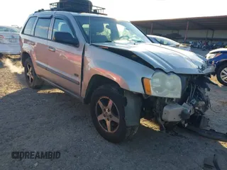 2007 Jeep Grand Cherokee Laredo with VIN 1J8GS48K07C630303, listed as a IAAI auction lot 40993022 with 254,294 mi miles. Bid and sale history available at carsss.com. Image 1.