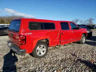 2015 Chevrolet Silverado 1500 LTZ with VIN 3GCUKSEJXFG124659, listed as a Copart auction lot 84235544 with 159,963 mi miles and Salvage Title. Bid and sale history available at carsss.com. Image 3.