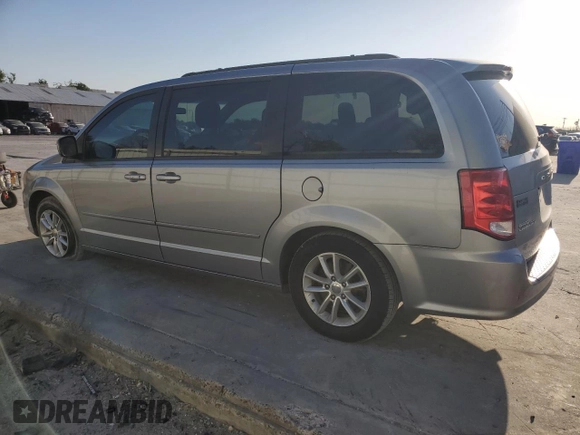 2014 Dodge Grand Caravan SXT with VIN 2C4RDGCG1ER121033, listed as a Copart auction lot 52030715 with 105,451 mi miles and Salvage Title. Bid and sale history available at DreamBid. Image 2.