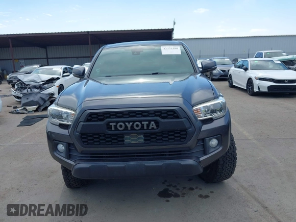 2019 Toyota Tacoma SR with VIN 3TMCZ5AN3KM207783, listed as a IAAI auction lot 42375280 with 55,784 mi miles and . Bid and sale history available at DreamBid. Image 13.