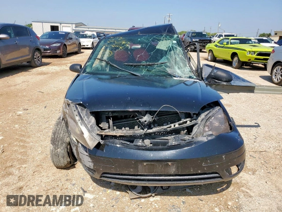 2007 Ford Focus S with VIN 1FAFP31NX7W130558, listed as a Copart auction lot 58385805 with Not provided miles and Non repairable. Bid and sale history available at DreamBid. Image 5.