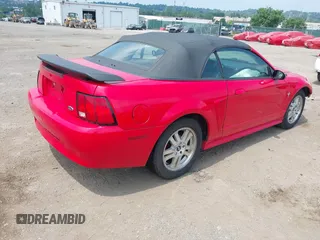 2003 Ford Mustang Deluxe z VIN 1FAFP44433F452977, wystawiony jako IAAI lot #42598309 z przebiegiem 99 596 mil mil oraz . Historia ofert i sprzedaży dostępna na DreamBid. Obrazek 4.
