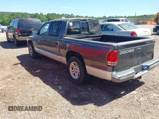 2001 Dodge Dakota Sport z VIN 1B7HL2ANX1S297770, wystawiony jako IAAI lot #42309715 z przebiegiem 279 458 mil mil oraz . Historia ofert i sprzedaży dostępna na DreamBid. Obrazek 3.