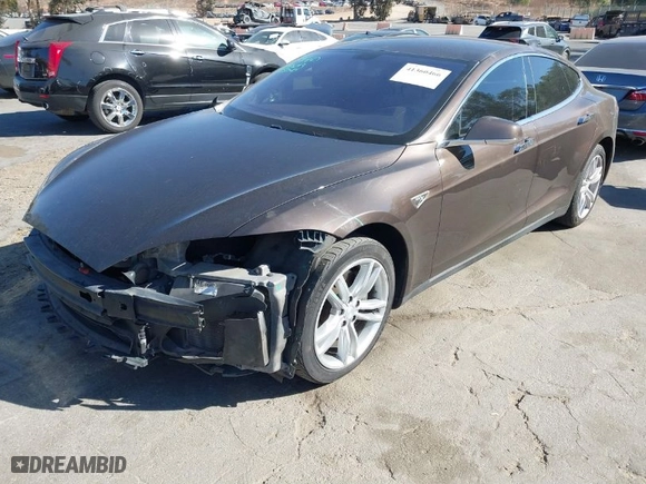 2013 Tesla Model S with VIN 5YJSA1DN4DFP19552, listed as a IAAI auction lot 41360466 with 129,806 mi miles. Bid and sale history available at carsss.com. Image 2.