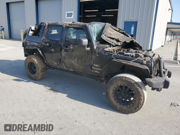 2012 Jeep Wrangler Unlimited Sahara with VIN 1C4BJWEG5CL235835, listed as a Copart auction lot 60673555 with 86,606 mi miles and Salvage title. Bid and sale history available at DreamBid. Image 4.