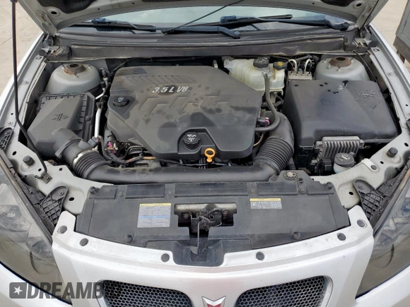 2009 Pontiac G6 1SA z VIN 1G2ZG57N394176715, wystawiony jako Copart lot #58756565 z przebiegiem 137 416 mil mil oraz Czysty tytuł • Clean title. Historia ofert i sprzedaży dostępna na DreamBid. Obrazek 11.
