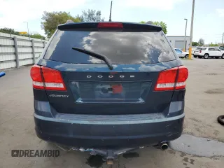 2013 Dodge Journey SE with VIN 3C4PDCAB7DT680055, listed as a Copart auction lot 58241435 with 199,620 mi miles and Salvage title. Bid and sale history available at DreamBid. Image 6.