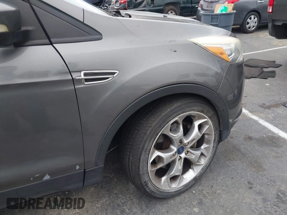 2013 Ford Escape Titanium with VIN 1FMCU0J95DUC71130, listed as a IAAI auction lot 42072032 with 144,054 mi miles and . Bid and sale history available at carsss.com. Image 6.