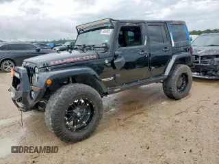 2015 Jeep Wrangler Unlimited Rubicon Hard Rock with VIN 1C4HJWFG1FL710264, listed as a Copart auction lot 54123285 with 96,737 mi miles and Salvage title. Bid and sale history available at DreamBid. Image 1.