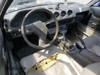 1982 Datsun 280ZX z VIN JN1HZ04SXCX448748, wystawiony jako Copart lot #87670125 z przebiegiem 136 264 mil mil oraz Szkody całkowita. Historia ofert i sprzedaży dostępna na DreamBid. Obrazek 8.