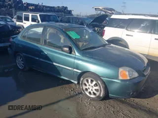 2003 Kia Rio with VIN KNADC125836238197, listed as a IAAI auction lot 41781730 with 138,384 mi miles. Bid and sale history available at carsss.com. Image 1.