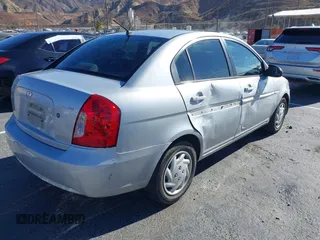 2006 Hyundai Accent GLS with VIN KMHCN46C16U023680, listed as a IAAI auction lot 41253207 with 157,398 mi miles. Bid and sale history available at carsss.com. Image 4.