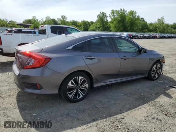 2018 Honda Civic EX-T z VIN 19XFC1F32JE200959, wystawiony jako Copart lot #58049855 z przebiegiem 95 123 mil mil oraz Szkoda całkowita • Salvage title. Historia ofert i sprzedaży dostępna na DreamBid. Obrazek 3.