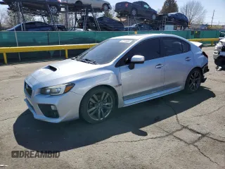 2016 Subaru WRX Limited with VIN JF1VA1J65G9818699, listed as a Copart auction lot 52116595 with 123,247 mi miles and Salvage title. Bid and sale history available at DreamBid. Image 1.