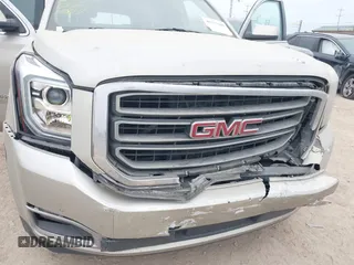 2015 GMC Yukon XL SLE z VIN 1GKS1GKC1FR155056, wystawiony jako IAAI lot #41517607 z przebiegiem 174 634 mil mil oraz . Historia ofert i sprzedaży dostępna na DreamBid. Obrazek 6.