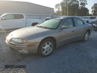 2003 Oldsmobile Aurora z VIN 1G3GS64C434101104, wystawiony jako Copart lot #74995974 z przebiegiem Nie podano mil oraz Szkody całkowita. Historia ofert i sprzedaży dostępna na DreamBid. Obrazek 1.