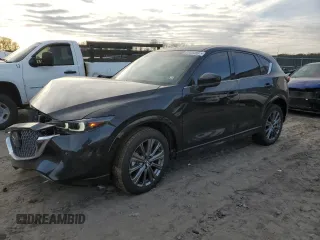 2024 Mazda CX-5 2.5 Turbo Signature with VIN JM3KFBXY7R0515256, listed as a Copart auction lot 87404694 with 4,699 mi miles and Salvage Title. Bid and sale history available at carsss.com. Image 1.