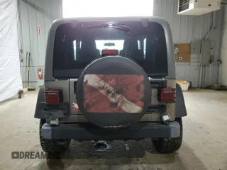 2005 Jeep Wrangler Sport z VIN 1J4FA49S75P325028, wystawiony jako Copart lot #56942315 z przebiegiem 169 988 mil mil oraz Szkoda całkowita • Salvage title. Historia ofert i sprzedaży dostępna na DreamBid. Obrazek 6.