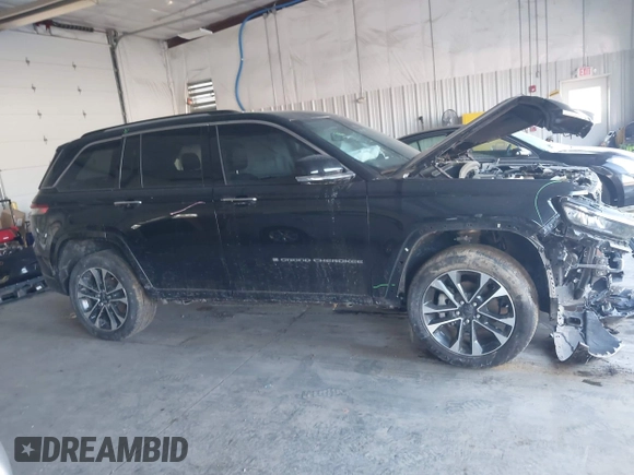 2023 Jeep Grand Cherokee Overland with VIN 1C4RJHDG5PC507978, listed as a IAAI auction lot 41394199 with 57,323 mi miles and . Bid and sale history available at DreamBid. Image 13.