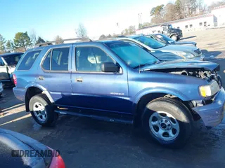 2004 Isuzu Rodeo S with VIN 4S2CK58W444314265, listed as a IAAI auction lot 41294636 with 291,080 mi miles and . Bid and sale history available at DreamBid. Image 13.