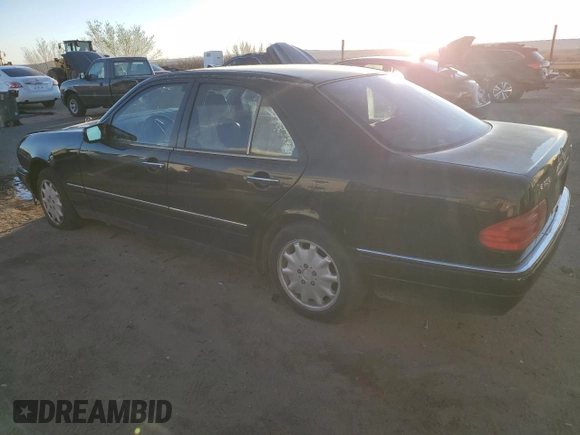 1999 Mercedes-Benz E-Class with VIN WDBJF82H9XX026911, listed as a Copart auction lot 48808835 with 205,953 mi miles and Salvage Title. Bid and sale history available at carsss.com. Image 2.