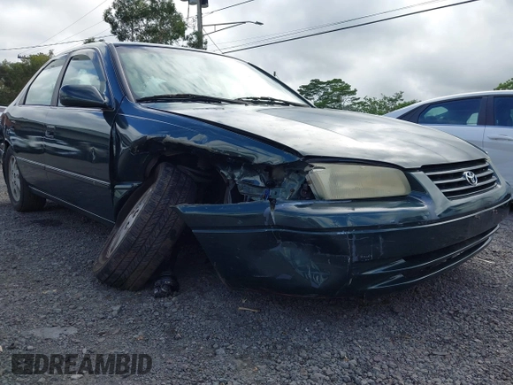 1999 Toyota Camry LE z VIN JT2BF22K2X0164080, wystawiony jako IAAI lot #40984874 z przebiegiem Nie podano mil oraz . Historia ofert i sprzedaży dostępna na DreamBid. Obrazek 6.