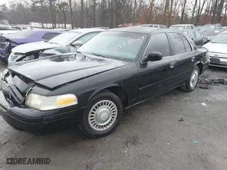 1999 Ford Crown Victoria Police Pkg with VIN 2FAFP71W3XX130521, listed as a IAAI auction lot 41384939 with 257,504 mi miles. Bid and sale history available at carsss.com. Image 2.