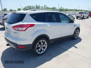 2013 Ford Escape Titanium with VIN 1FMCU0J9XDUA33872, listed as a IAAI auction lot 42009286 with 161,677 mi miles. Bid and sale history available at carsss.com. Image 4.