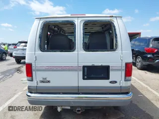 1999 Ford Econoline Cargo Recreational with VIN 1FDRE14L2XHA41059, listed as a IAAI auction lot 42067879 with 149,185 mi miles. Bid and sale history available at carsss.com. Image 16.