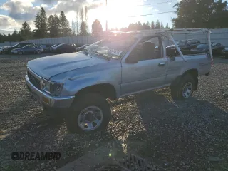 1991 Toyota Pickup DX with VIN JT4RN01P7M0009935, listed as a Copart auction lot 83619614 with 293,103 mi miles and Salvage Title. Bid and sale history available at DreamBid. Image 1.